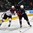 GRAND FORKS, NORTH DAKOTA - APRIL 17: USA's Graham Mcphee #21 and Latvia's Markuss Komuls #2 battle for the puck during preliminary round action at the 2016 IIHF Ice Hockey U18 World Championship. (Photo by Matt Zambonin/HHOF-IIHF Images)

